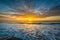 Waves in the Atlantic Ocean and sunrise, in Isle of Palms, South Carolina