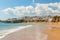 Waves on the beach in Albufeira fishermen. Portuguese town.