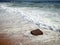 Waves on beach and cube