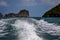 Waves behind the speedboat in the background Rocks marine reserve