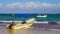 Waves boats caribbean coast and beach panorama view Tulum Mexico