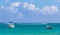 Waves boats caribbean coast and beach panorama view Tulum Mexico