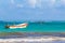 Waves boats pelicans caribbean coast and beach panorama Tulum Mexico