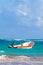 Waves boats pelicans caribbean coast and beach panorama Tulum Mexico