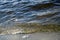 Waves break on the granite stone near the shore of the Gulf of Finland near the village of Repino, Leningrad region. Saint-Petersb