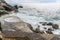 Waves break on the quayside at Gavitella Beach in Praiano. Italy on the Amalfi coast