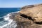 Waves breaking on dramatic cliffs on southern coast, Montana Pelada mountain, Tenerife, Canary Islands, Spain