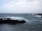 Waves breaking on the historic old harbour in puerto cruz