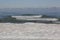 Waves breaking on an icy lake Michigan Shoreline on a sub-zero w