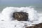 Waves breaking over rocks