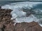 Waves breaking over rocks at Islote Sancho, Riviere Des Galets, Mauritius