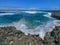 Waves breaking over rocks at Islote Sancho, Riviere Des Galets, Mauritius