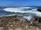 Waves breaking over rocks at Islote Sancho, Riviere Des Galets, Mauritius