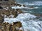 Waves breaking over rocks at Islote Sancho, Riviere Des Galets, Mauritius