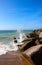 Waves breaking on rocks along beach