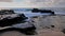 Waves breaking on rocks close to Sandy beach, Oahu, Hawaii