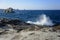 Waves breaking on rocky beach