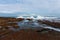 Waves breaking on a rocky seashore at the Atlantic ocean