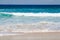 Waves breaking on sunny beach in Australia