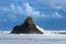 Waves breaking on tiny, rocky Paratahi Island, New Zealand