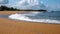 Waves breaking on a tropical island beach