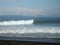 Waves breaks into surf along beach