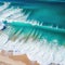 Waves chrashing on a tropical beach seen from a drone view