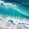 Waves chrashing on a tropical beach seen from a drone view