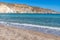 Waves, cliffs, rocks and sand in  Firopotamos beach