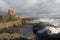 Waves crash on fife shore below Lady\'s tower