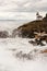 Waves Crash onto Sharp Rocks Jetty San Juan Island Lighthouse