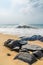 Waves crashin on beautiful beach with large black rocks, Robertsport, Liberia, West Africa