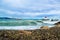 Waves crashing on breakwaters with two lighthouses near the marina. Villeneuve-Loubet. France