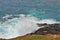 Waves crashing in a natural blowhole on the Australian coast