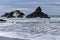 Waves crashing over the sea stacks on the Pacific coast at Harris Beach State Park, Oregon, USA