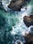 waves crashing on rocks. Aerial view of sea waves and rocky coast