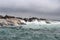 Waves crashing on rocks with sealions