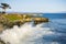 Waves crashing on the rocky shoreline of the Pacific Coast; Santa Cruz, California