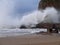 Waves crashing on sea wall and rocks at Hope Cove harbour in Devon, England. 2