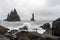 Waves crashing in on shore on Reynisfjara near the city of Vik in Iceland. Basalt colomns and volcanic rocks
