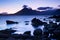 Waves crashing on shoreline with moody dramatic sky at Elgol on the Isle of Skye, Scotland, UK.