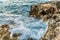 Waves Crushing on a Rocky Beach. Water Splashes on the Rocks in the Greek Islanf of Chania, Greece