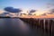 Waves fence attack of the sea in sunrise time