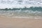 waves and foam of sea water with clear water on one of the beaches on the island of Lombok, Indonesia