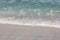 waves and foam of sea water with clear water on one of the beaches on the island of Lombok, Indonesia