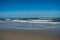 Waves gently rolling onto the beach from the Atlantic Ocean