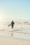 Those waves got my adrenaline pumping. a handsome young man at the beach with his surfboard.