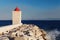 Waves hitting stones at the base of the lighthouse - Croatia, is