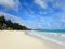 Waves lap on shore with Lifeguard Tower on Waimanalo Beach