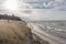 Waves lapping on shore in Grand Bend Ontario from Lake Huron on a cloudy day late afternoon